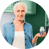 VisiFlora customer holding her bottle at home
