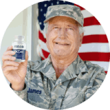 VisiFlora customer, a veteran, holding his bottle