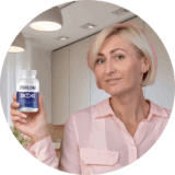 VisiFlora customer holding her bottle in a bright kitchen